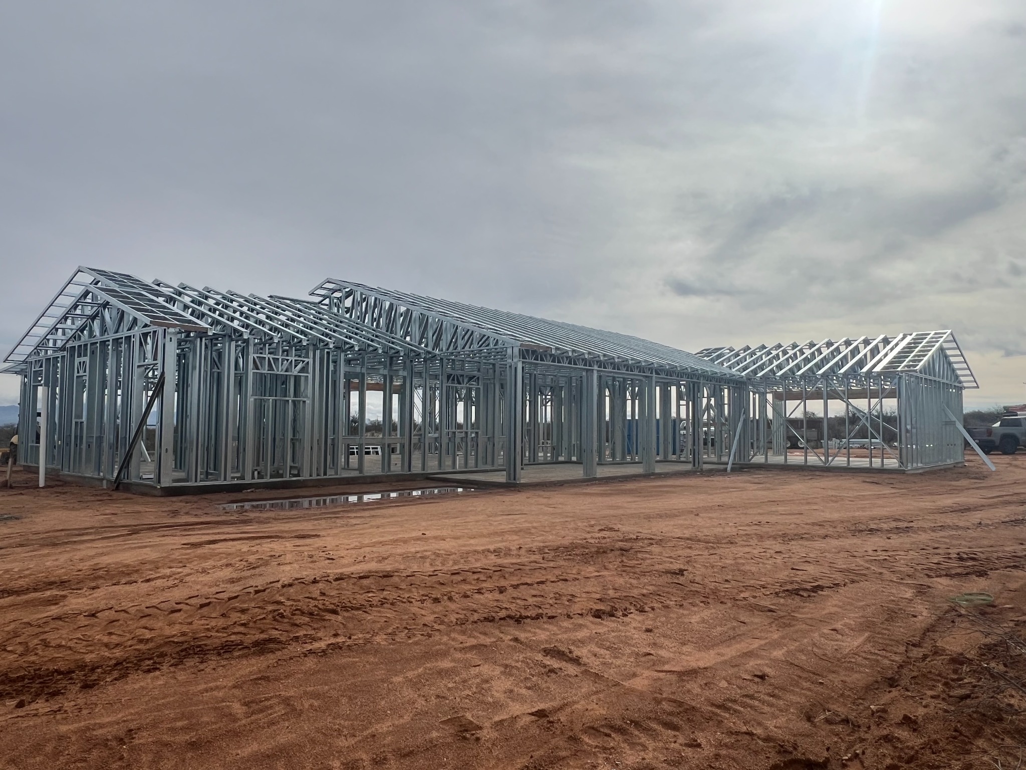 Cold-formed steel home framing with walls and roof structure assembled at the jobsite.